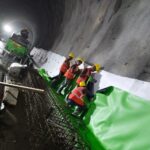 PVC geomembrane installation for tunnel waterproofing using geotextile protection in an underground infrastructure project