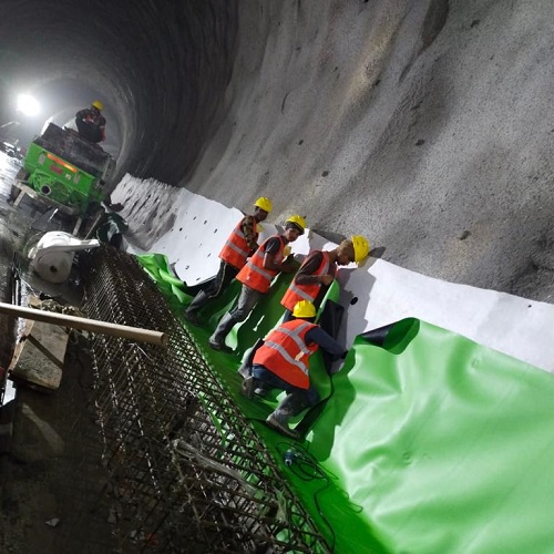 PVC geomembrane installation for tunnel waterproofing using geotextile protection in an underground infrastructure project