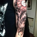 Professional tattoo artist creating a custom tattoo design at a tattoo studio Croydon with modern equipment and safe tattooing practices.