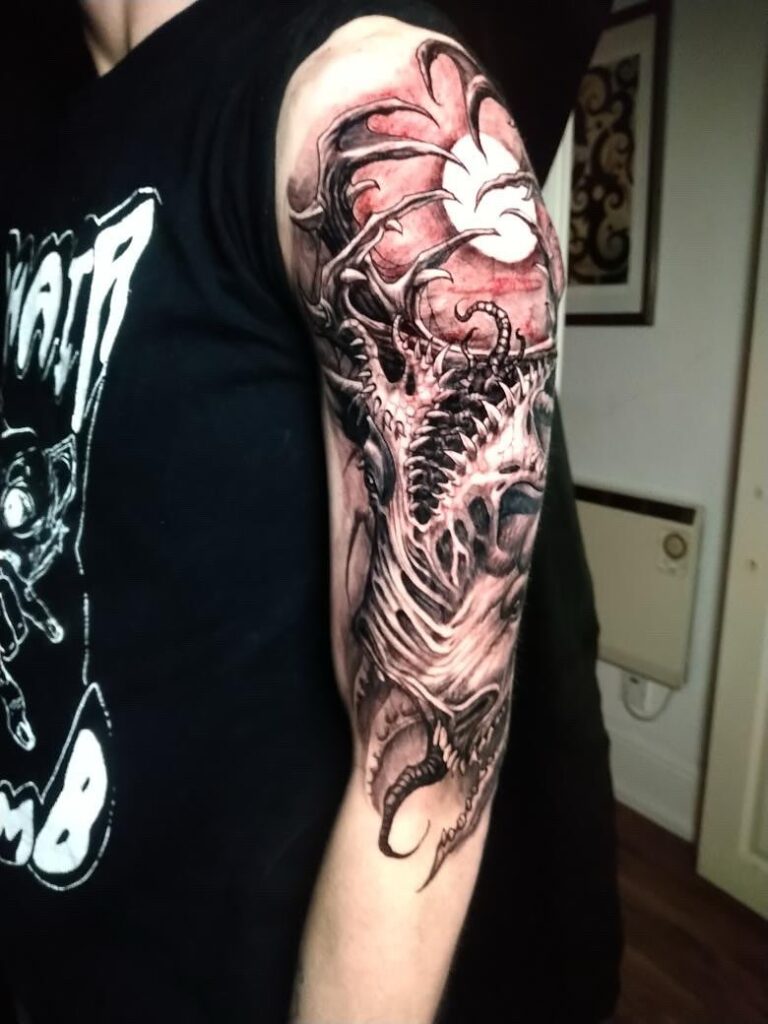 Professional tattoo artist creating a custom tattoo design at a tattoo studio Croydon with modern equipment and safe tattooing practices.